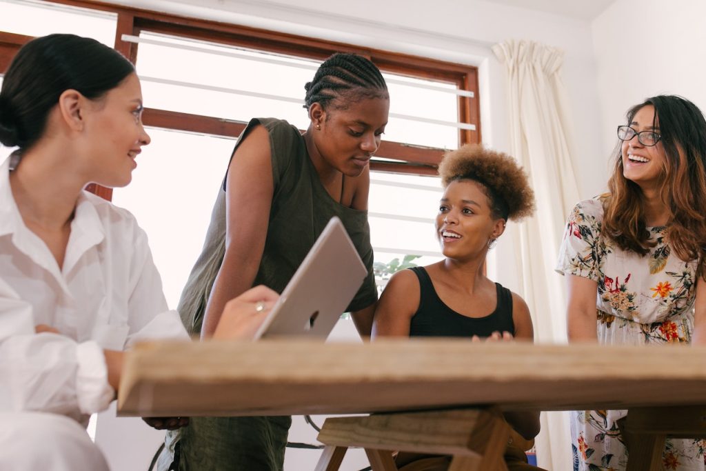 group of women working around a table