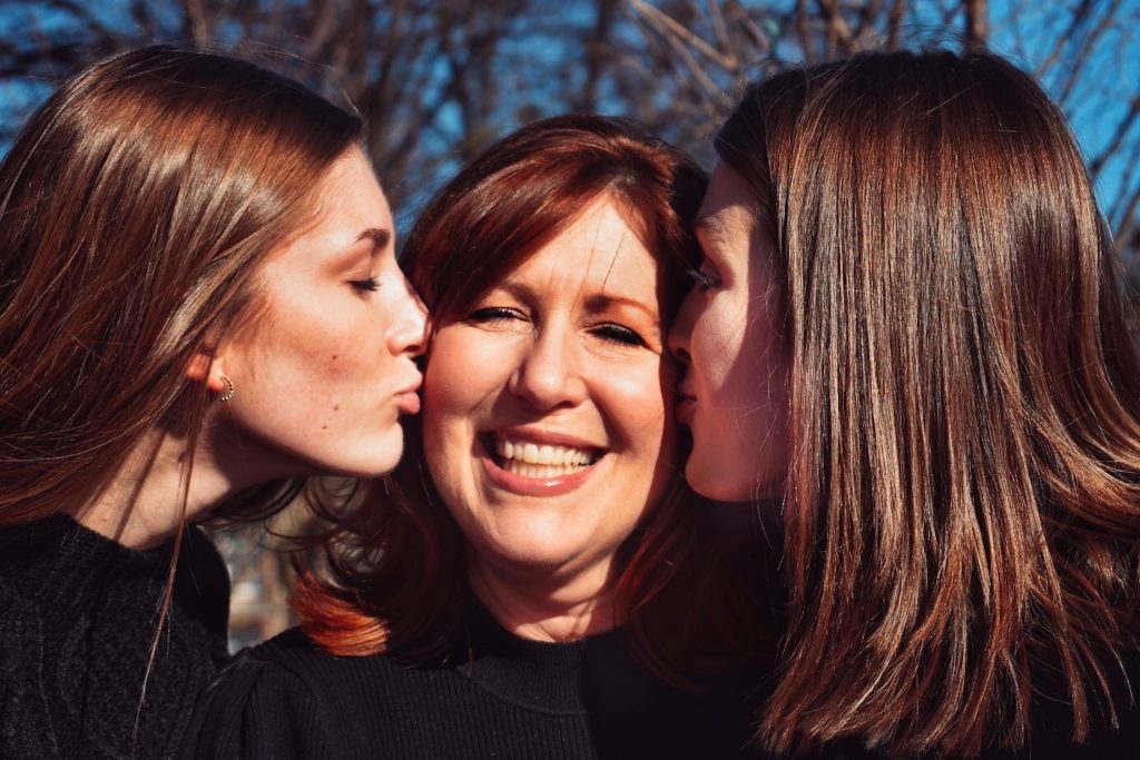 woman surrounded by friends