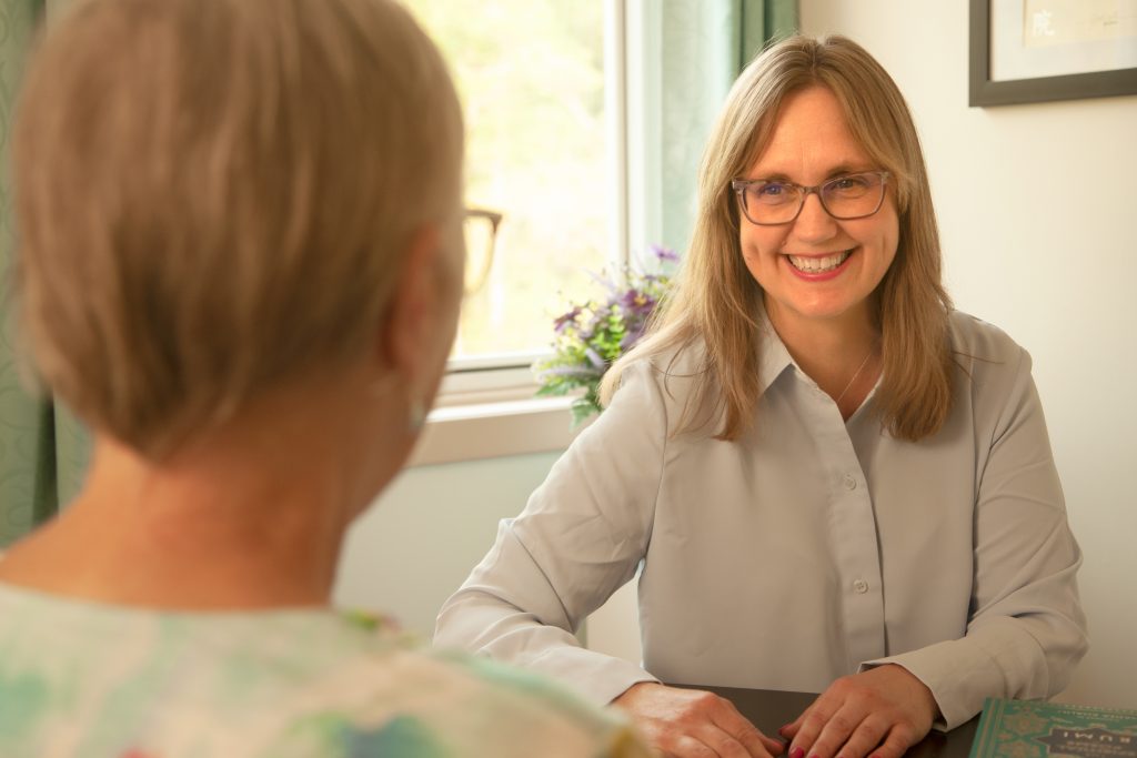 Abby consulting with a patient