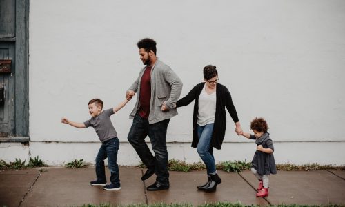 family walking hand in hand
